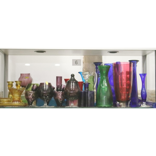 31 - An assortment of decorative coloured glass vases, pedestal drinking glasses and other items