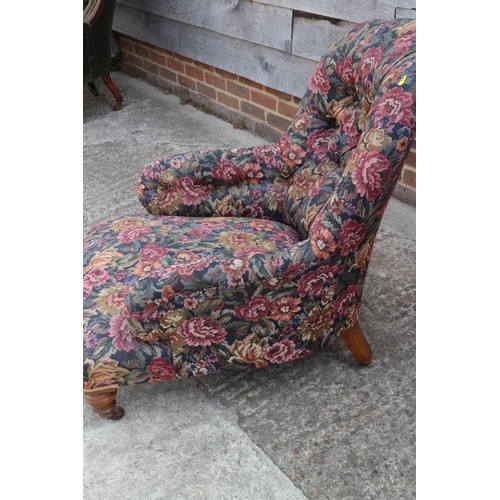 395 - A late Victorian button back deep seat armchair, upholstered in a floral fabric, on turned and casto... 