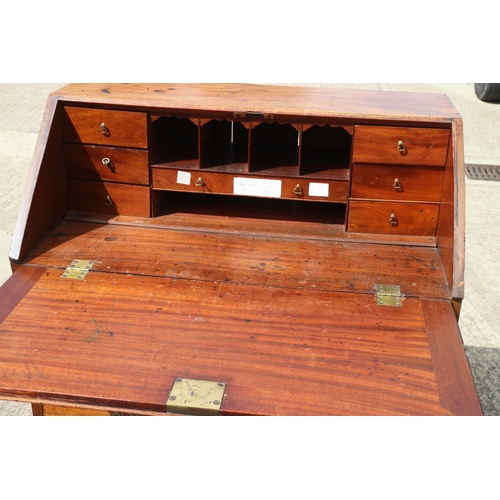 399 - A Georgian mahogany fall front bureau with fitted interior, over four long graduated drawers with pi... 