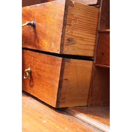 399 - A Georgian mahogany fall front bureau with fitted interior, over four long graduated drawers with pi... 