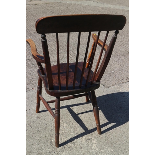 408 - A 19th century stained wooden Windsor spindle back kitchen armchair