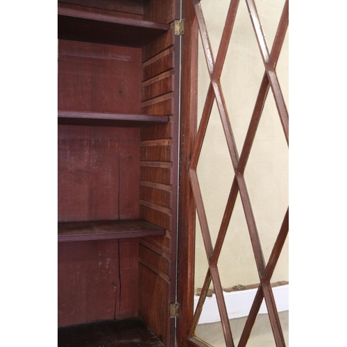 429 - A Georgian mahogany secretaire bookcase, the upper section enclosed two lattice glazed doors, over f... 