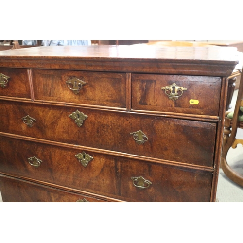 431 - An 18th century provincial figured walnut and banded chest of three small and three long graduated d... 