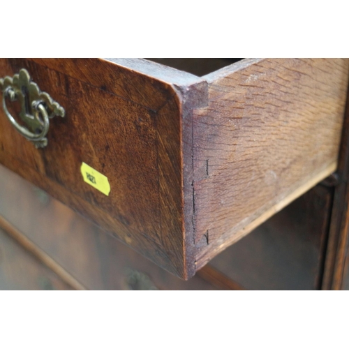 431 - An 18th century provincial figured walnut and banded chest of three small and three long graduated d... 