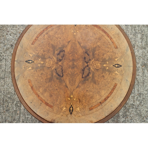 438 - A 19th century figured mahogany and walnut inlaid circular top occasional table, on turned and taper... 