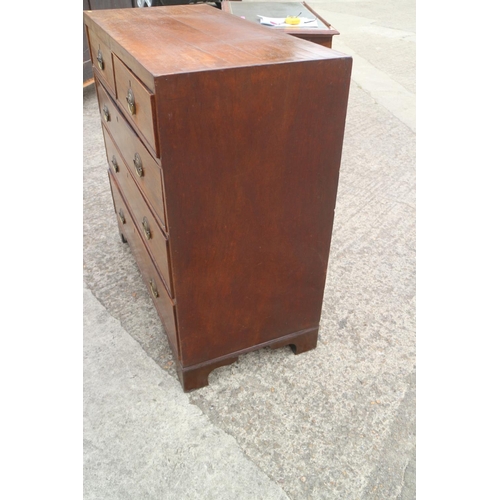 440 - A 19th century mahogany chest of two short and three long graduated drawers with oval brass handle p... 