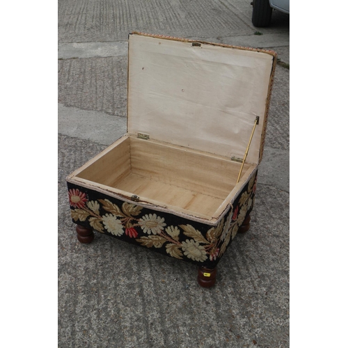 452 - A 19th century box seat ottoman, upholstered in a floral tapestry, on turned supports, 26