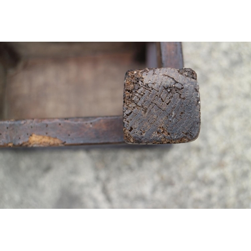 454 - An antique carved oak joint stool of 17th century design with carved decoration, on turned supports,... 