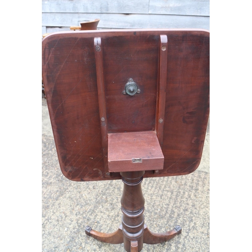 459 - A 19th century mahogany rectangular tilt top occasional table, on turned column and tripod splay sup... 