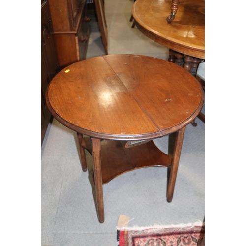 494 - A 1930s walnut folding two-tier occasional table, on turned and shaped supports, 23 1/2