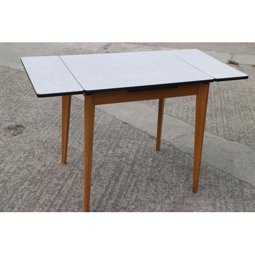 501 - A 1960s Formica top draw leaf  table, on splay supports, 30