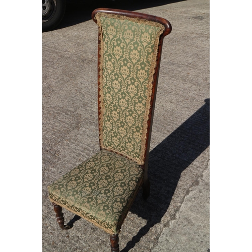 505 - An early 20th century prie-dieu chair with grained as rosewood frame, upholstered in a green fabric