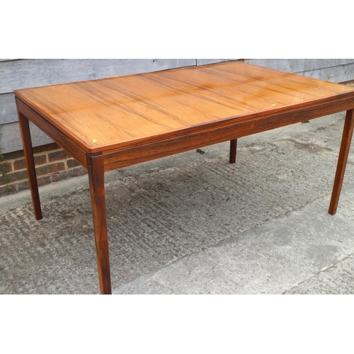 511 - A 1960s Danish rosewood dining suite comprising table, on moulded supports, 59