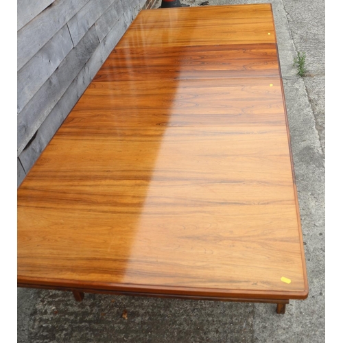 511 - A 1960s Danish rosewood dining suite comprising table, on moulded supports, 59