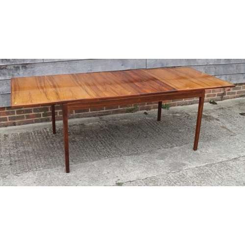 511 - A 1960s Danish rosewood dining suite comprising table, on moulded supports, 59