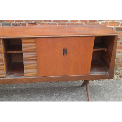 514 - A 1960s EON teak sideboard, fitted cupboards and three drawers, on splay supports, 88