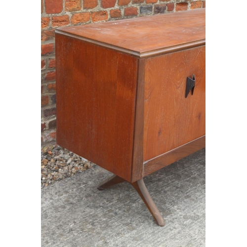 514 - A 1960s EON teak sideboard, fitted cupboards and three drawers, on splay supports, 88