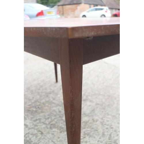 515 - A 1960s EON extending dining table with one leaf, on slender supports, 56