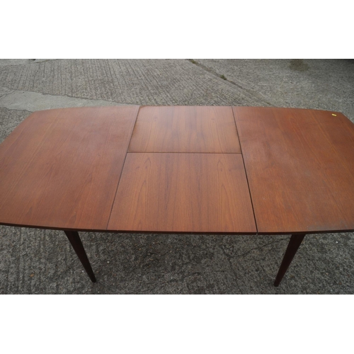 515 - A 1960s EON extending dining table with one leaf, on slender supports, 56