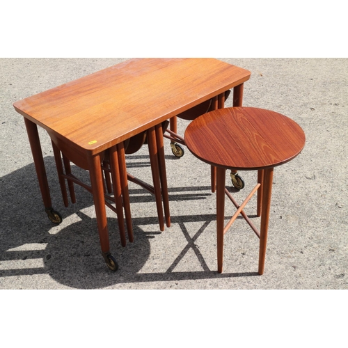 564 - A set of five teak occasional tables, four circular drop leaf and one rectangular table, 29