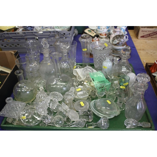 58 - Three Georgian ring necked decanters and matching stoppers, a quantity of cut and moulded glass deca... 