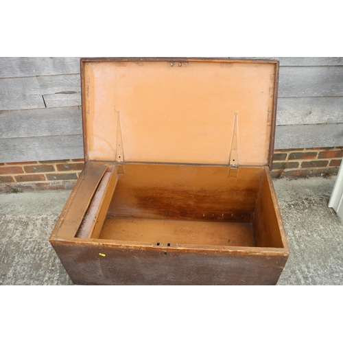 581 - A painted pine blanket box with padded top, candle box and wrought iron carry handles, 38