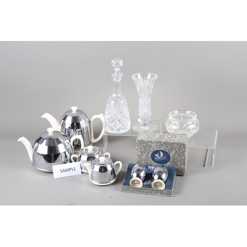 59 - An insulated four-piece teaset with egg cups, a 19th century panel and flute cut decanter, another d... 