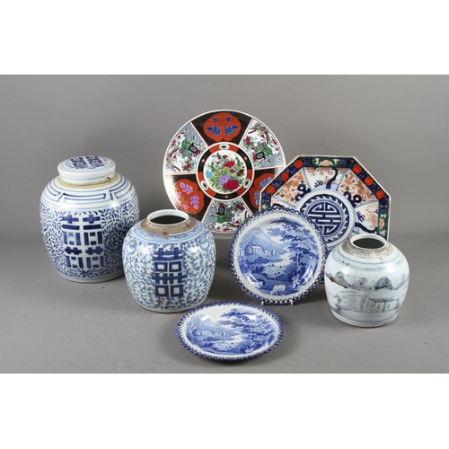 73 - A Chinese blue and white ginger jar and cover, decorated characters and foliage, 9 1/2