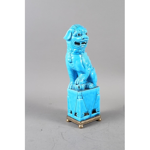 74 - A Chinese blue glazed Dog of Fo, on later brass stand, 12 1/4