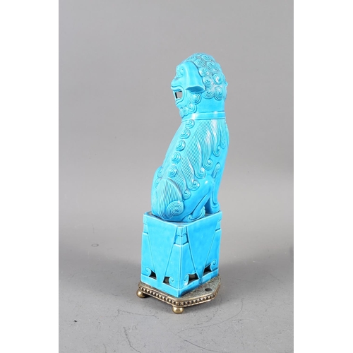 74 - A Chinese blue glazed Dog of Fo, on later brass stand, 12 1/4