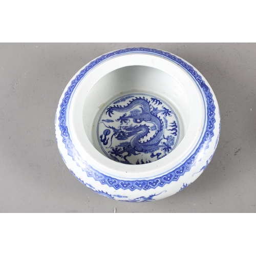 78 - A pair of Chinese blue and white dragon decorated porcelain stacking bowls, larger 9