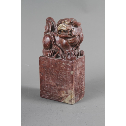 82 - A Chinese carved soapstone seal with Kylin surmount, a carved soapstone brushwash, four other smalle... 