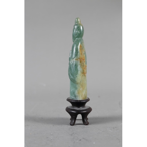 85 - A Chinese jade carving of Kuan-Yin, on wooden base, 8 1/2