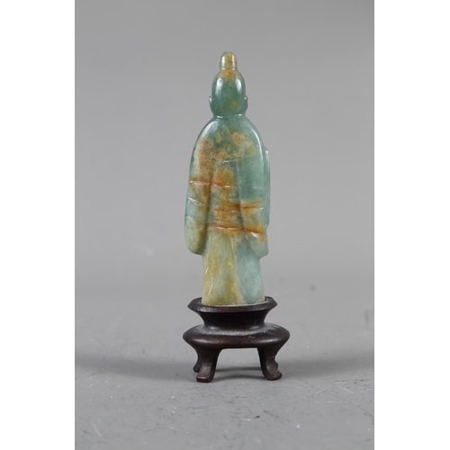 85 - A Chinese jade carving of Kuan-Yin, on wooden base, 8 1/2