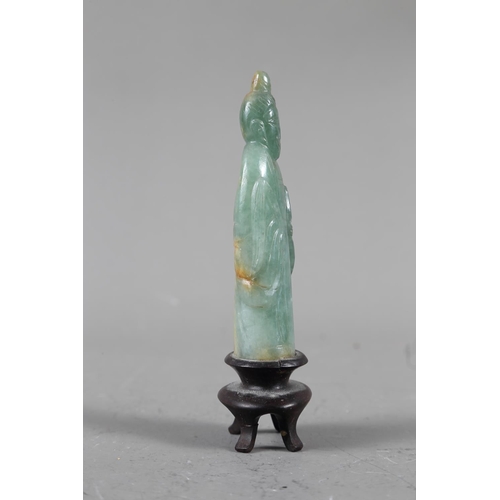 85 - A Chinese jade carving of Kuan-Yin, on wooden base, 8 1/2