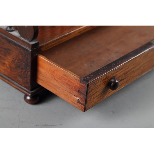 129 - An early 19th century rosewood double bookstand with slender spindle turned sides and handles, drawe... 