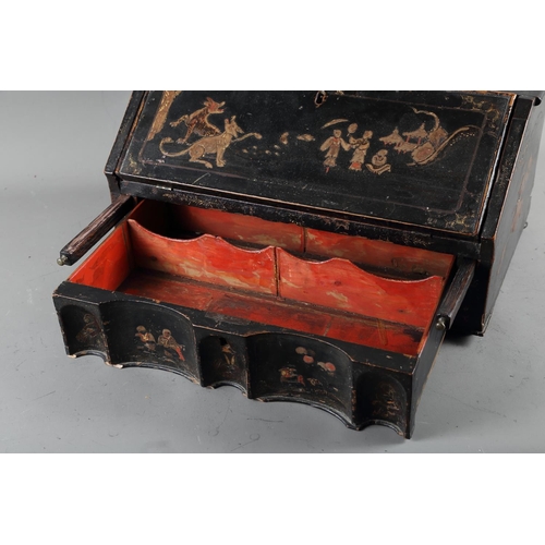 426 - An 18th century black lacquer and Chinoiserie decorated table desk with stepped interior and base dr... 