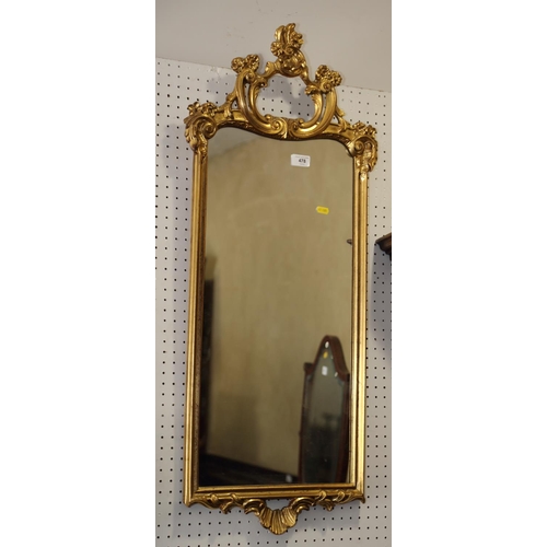 478 - A wall mirror, in ornate gilt frame, 38