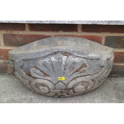 182 - A reconstituted stone hanging planter, 17