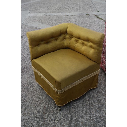 402 - A pair of button back corner armchairs, upholstered in a gold fabric with pattered loose covers