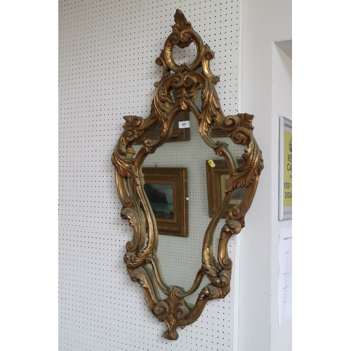 457 - An ornate gilt framed mirror, 41