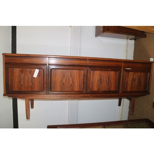 511 - A 1960s Danish rosewood dining suite comprising table, on moulded supports, 59