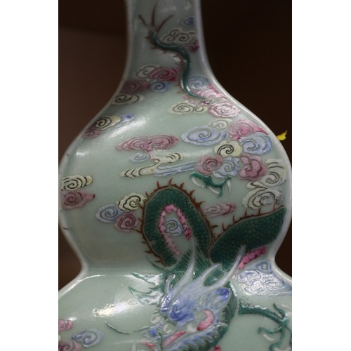 77 - A Chinese celadon glazed double gourd vase, 9