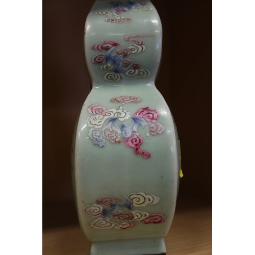 77 - A Chinese celadon glazed double gourd vase, 9