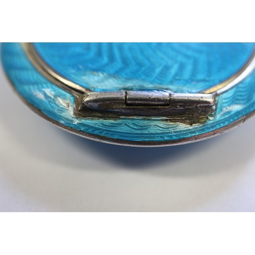 243 - A silver and blue guilloche enamel compact and a similar silver and enamel propelling pencil