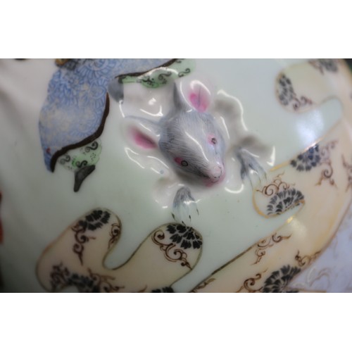 76 - An Imari porcelain hanging vase with figure and mouse decoration, 9