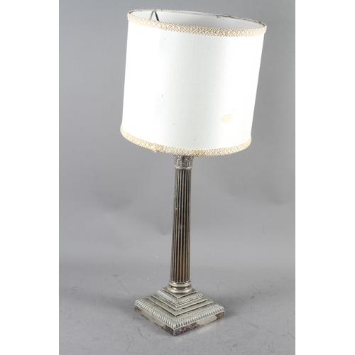 210 - A silver plated table lamp, formed as a column, on stepped base, 17 1/2