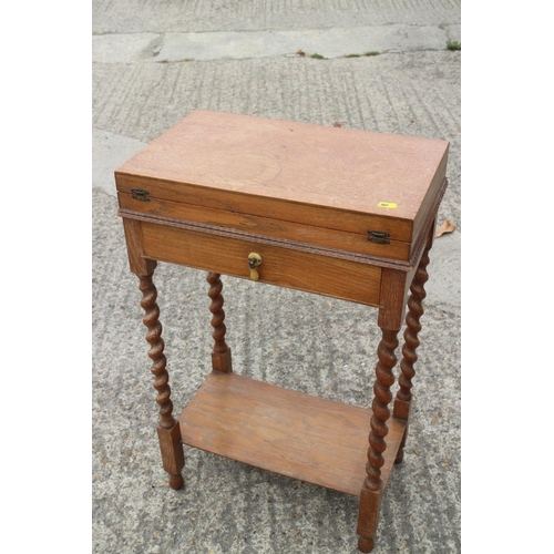 226 - A part set of silver plated cutlery, in an oak two-tier canteen, on barley twist supports