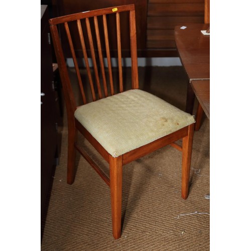 556 - A captain's spindle back elbow chair with panel seat, on turned supports, and a set of four modern d... 