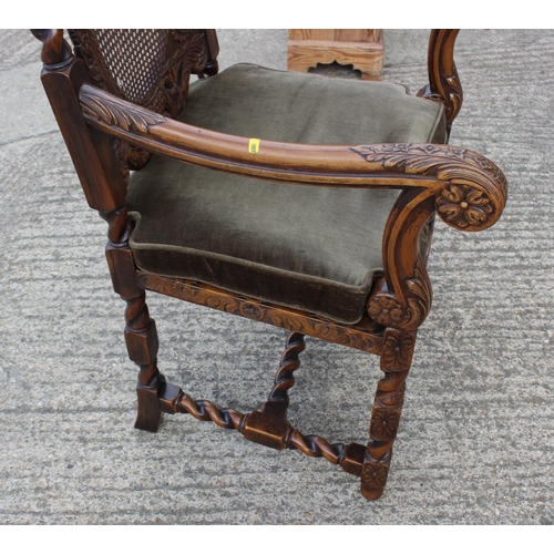 371 - A Restoration design carved walnut carver chair with oval cane back and seat, on barley twist stretc... 